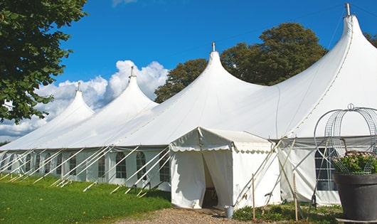 a line of portable restrooms in a shaded area, offering a comfortable experience for users in Hobart